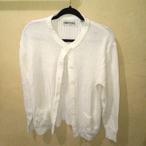 A white medium knit cardigan. You can also button it up and it has long sleeves.